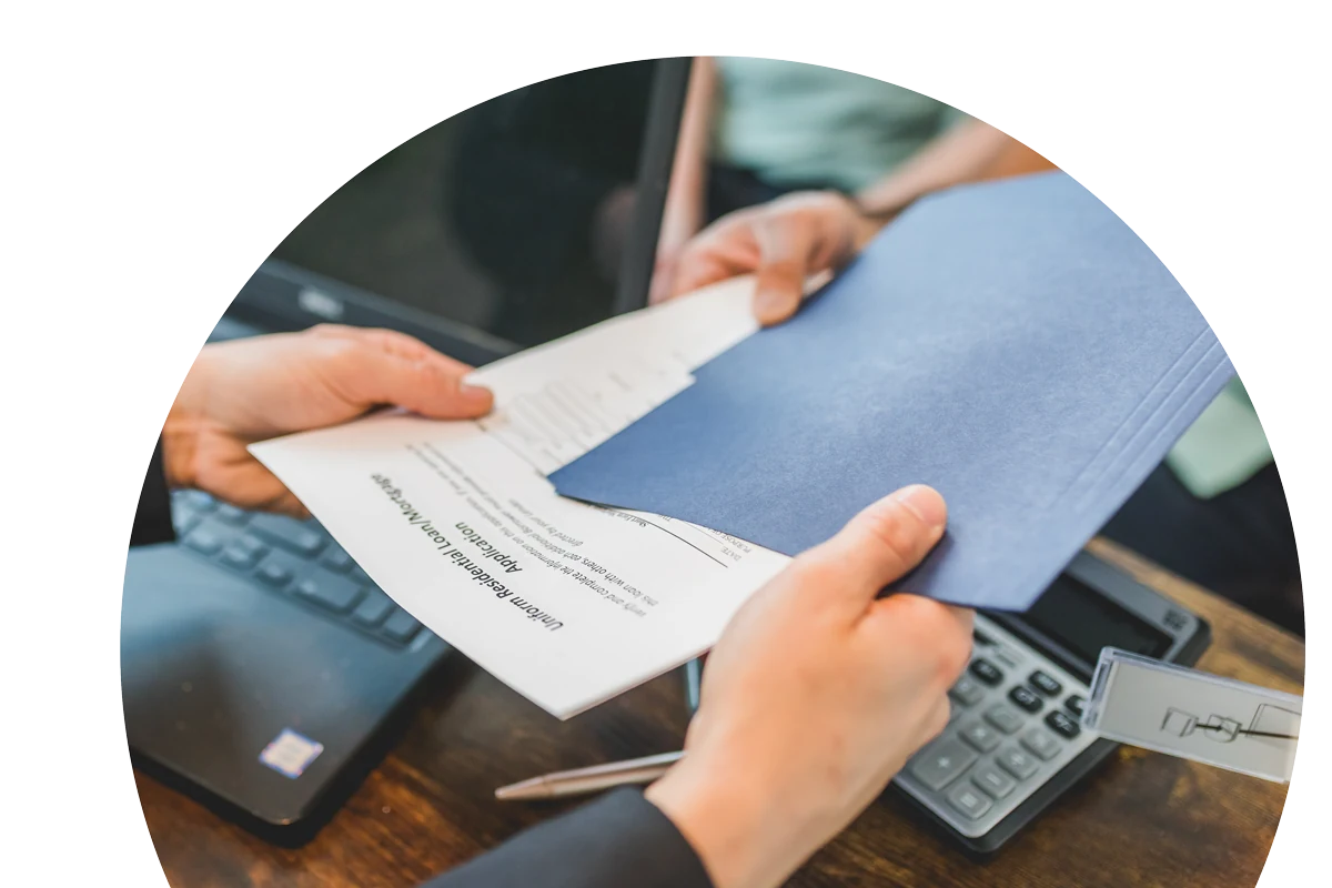 Mortgage documents being handed to a client